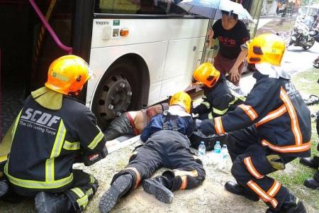 Man trapped under SBS bus. 'His legs looked flattened'