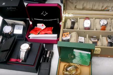 Gold bars, cash, luxury bags and watches seized