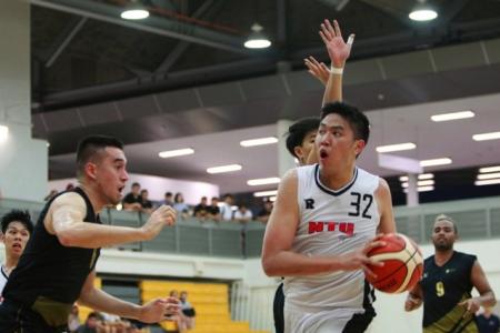 Russel Low (#32) had 13 points and played a pivotal role as his team NTU (white) defeated SIM 58-46 to win the IVP Basketball Championship.