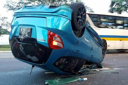 Car overturns after collision in Sembawang