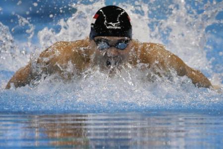 NCAA: Schooling helps Texas to two relay titles