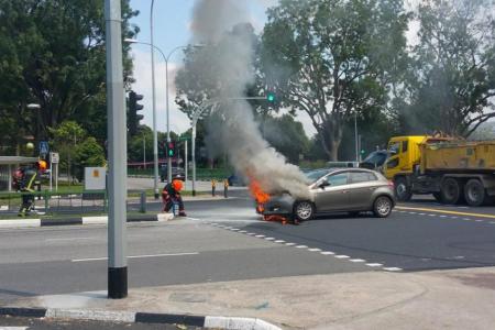 Republic Poly staff gets family from car before engine bursts into flames