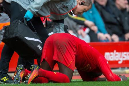  Liverpool&#039;s Sadio Mane tried to walk off but collapsed on the touchline before being substituted due to an injury 
