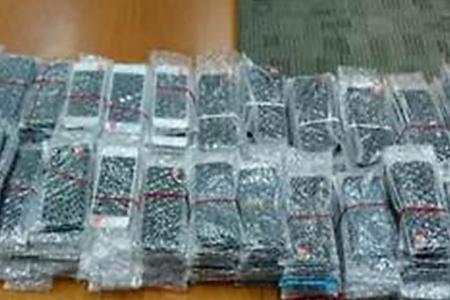 Eight men have been arrested under suspicion of selling counterfeit mobile phones.