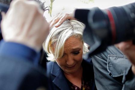 Protesters hurl eggs at French presidential candidate Marine Le Pen at campaign stop