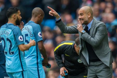Manchester City manager Pep Guardiola gives out instructions during the match against Crystal Palace
