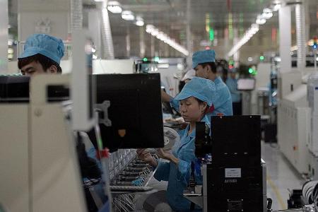 China factory output slows in April, as credit tightens