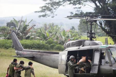 Helicopters, tanks in battle to retake Philippine city