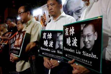 China scrambles to scrub tributes to Nobel laureate