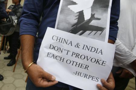 China warns India not to test its military