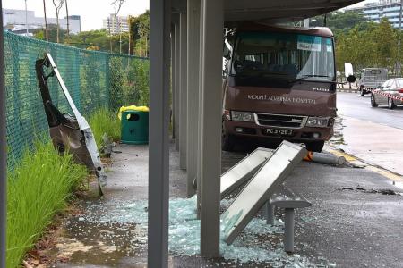 13 hurt after bus crashes into bus stop