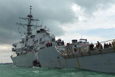 Search on for sailors missing after US warship collision