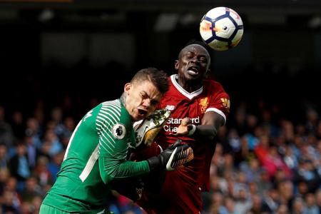 Manchester City’s Ederson Moraes is fouled by Liverpool&#039;s Sadio Mane resulting in a red card