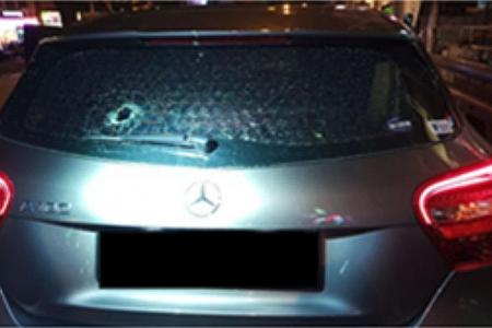 Cabby arrested for throwing pebbles at cars