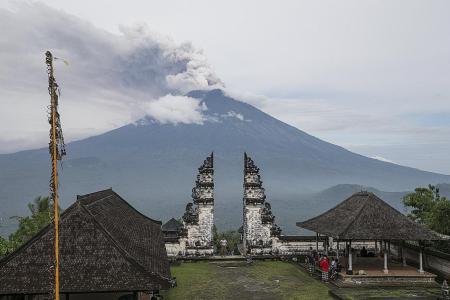 Bali airport reopens after winds clear ash