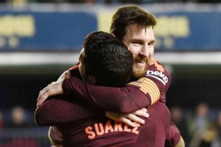 Suarez, Messi on target as Barca go five points clear