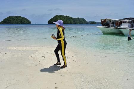 Pacific&#039;s Palau forces tourists to sign eco-pledge