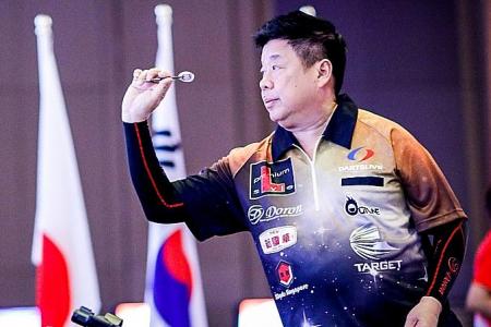 Singaporean darts player Paul Lim stuns former world champion