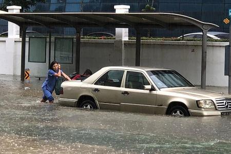 SCDF officers to the rescue as flood waters rise 