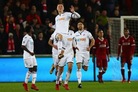 Liverpool's unbeaten run ends at bottom club Swansea