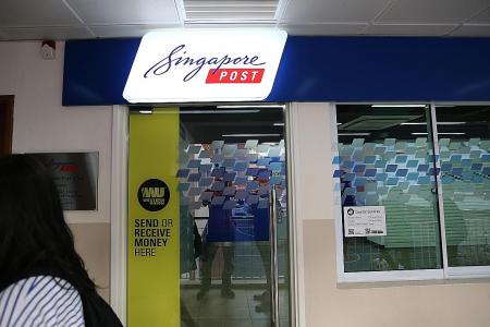 Hunt on for masked man who allegedly stole $3,000 from SingPost branch
