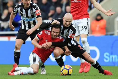 Newcastle stun Man United to move clear of drop zone