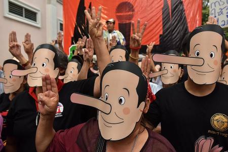Thai activists in Pinocchio masks call junta leader ‘liar’