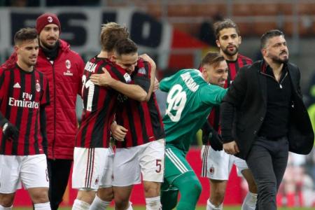 AC Milan players credit their upturn in form to coach Gennaro Gattuso (far right).