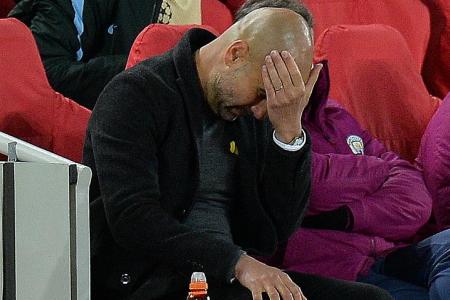 Man City boss Guardiola says tie not over despite 3-0 Anfield loss