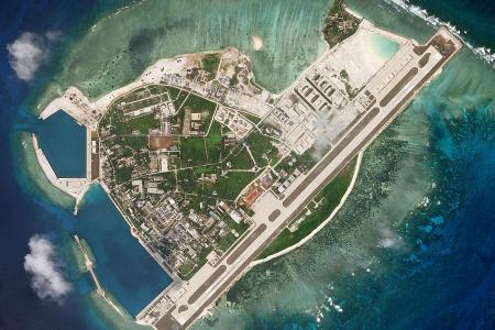US warships sail near South China Sea islands claimed by Beijing