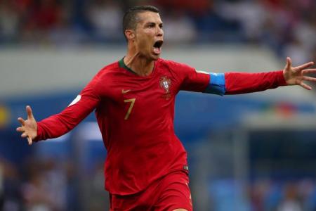 Hat-trick hero Ronaldo helps Portugal hold Spain 