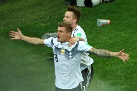 Kroos' late winner keeps Germany alive