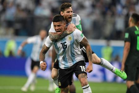 Argentina live on, thanks to Rojo's late goal