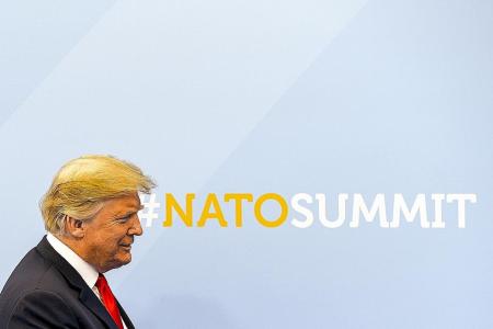 Trump lashes out at Nato allies as he lands for tense summit 