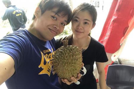 Durian giveaway on couple&#039;s 2nd wedding anniversary