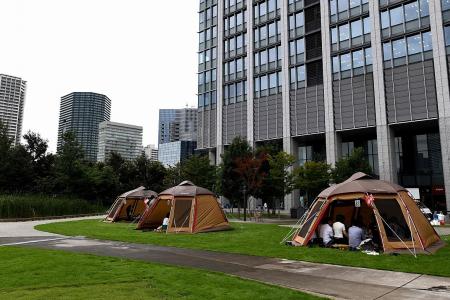 Out of Japan’s offices and into tents
