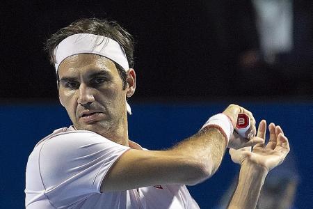 Federer survives tough test to reach second round