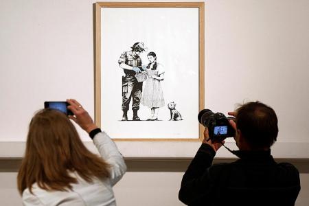 Banksy prints sell intact at stunt-free Paris auction