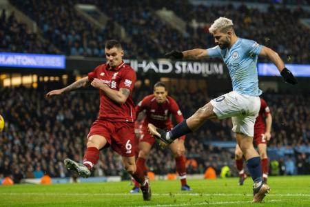 Man City cut Liverpool's lead to four points with 2-1 win