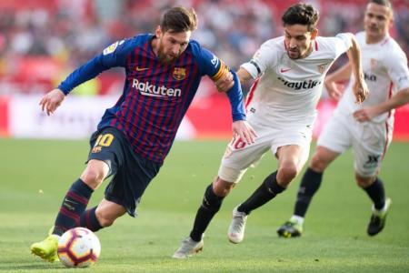 Barca sink Sevilla with Messi's 50th career hat-trick