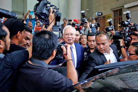 Ex-PM Najib pleads not guilty, in dock for three hours 