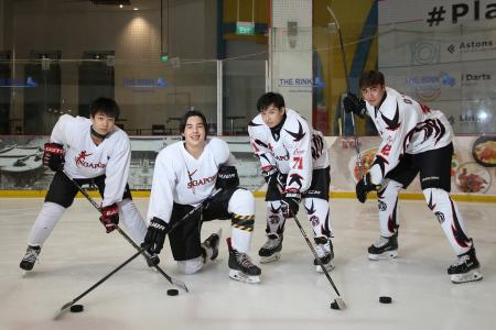 National ice hockey players take their schoolwork along during tourney