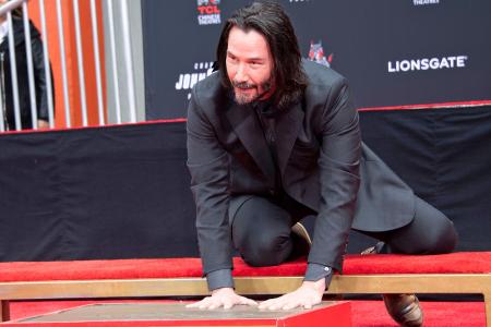 Keanu Reeves leaves his mark at Hollywood’s Chinese Theatre