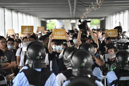 Protesters scuffle with HK cops, govt offices shut