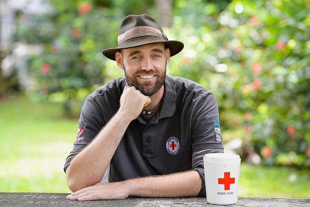 He journeys across the world without flying for the Red Cross