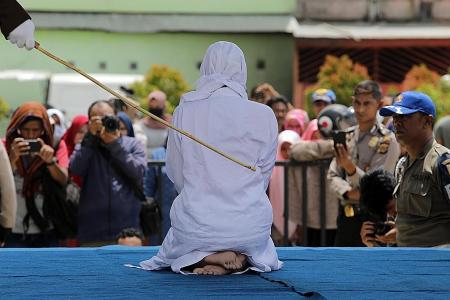 Two men, woman caned in Aceh for sexual offences