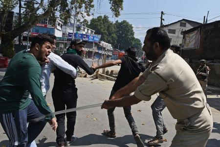 India imposes curfews in Kashmir after procession clashes