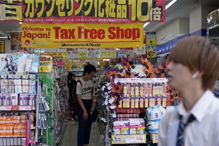Japan proceeds with twice-delayed sales tax hike