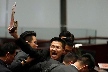 HK assembly disrupted for second day; lawmakers dragged out