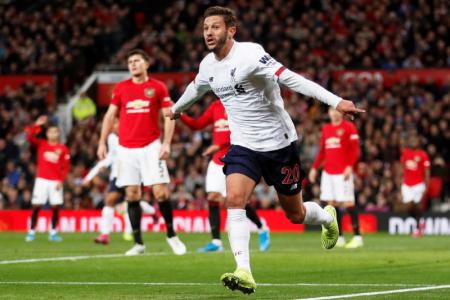 Lallana earns Liverpool a draw at Old Trafford